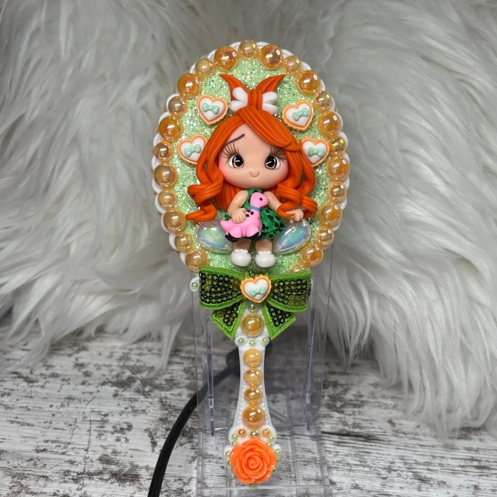 Pebbles Decorative Hand Mirror with Orange Accents